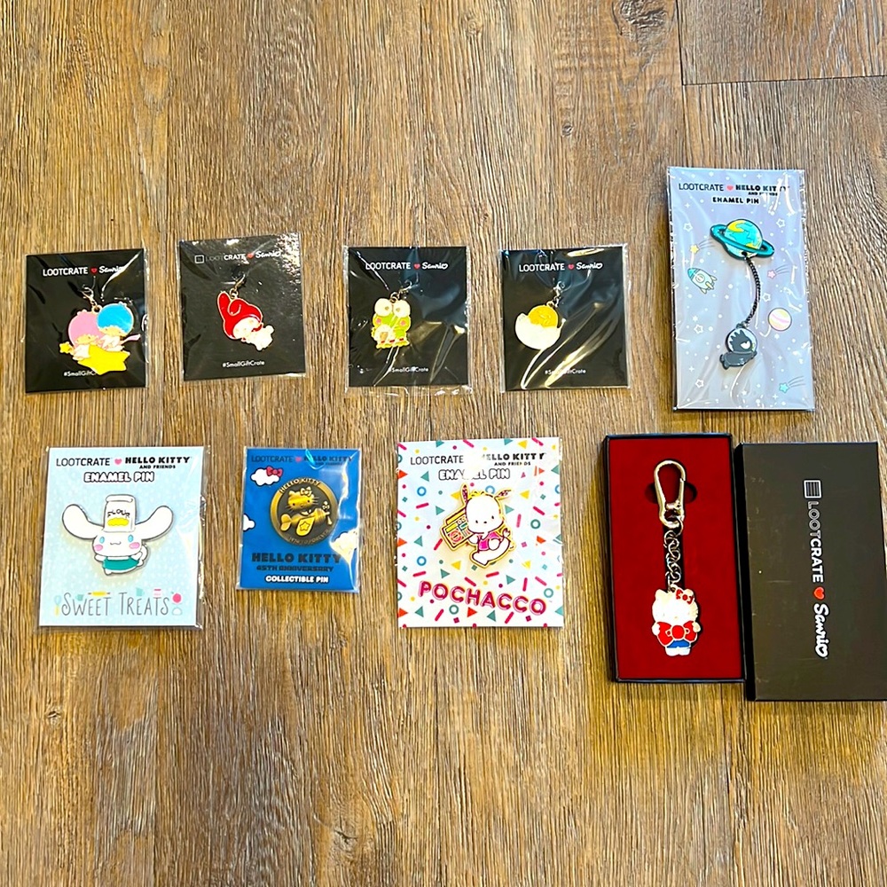 Hello Kitty and Friends Charms/Pins from Lootcrate.  Brand new and sealed!